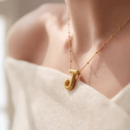Gold initial necklace J close-up